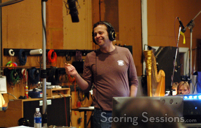 Composer Aaron Zigman conducts the orchestra