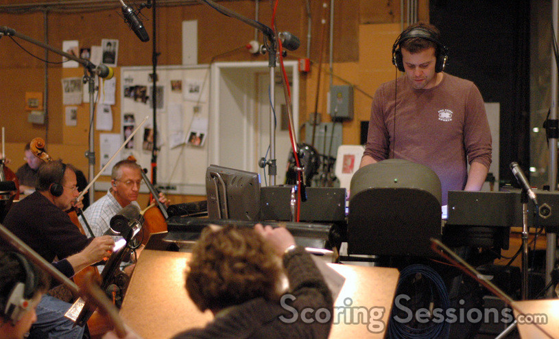 Composer Aaron Zigman conducts the orchestra