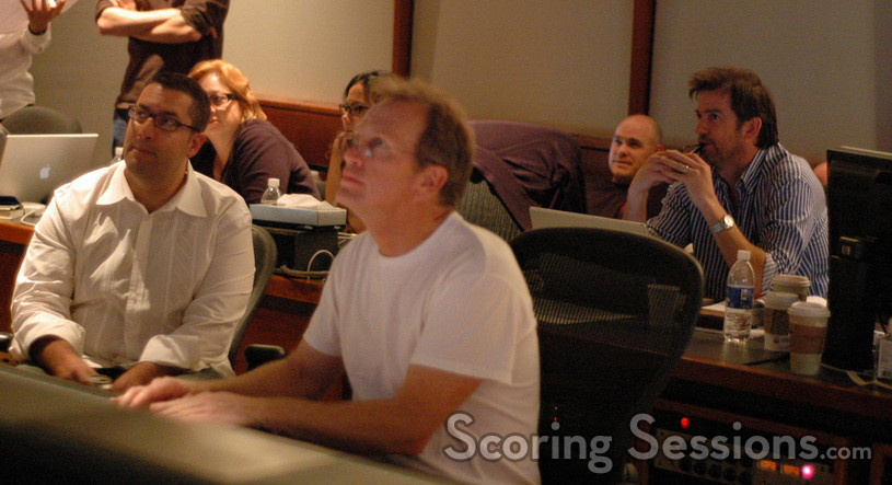 Chris Lennertz, Jeff Vaughn, and director Tom Dey listen to playback