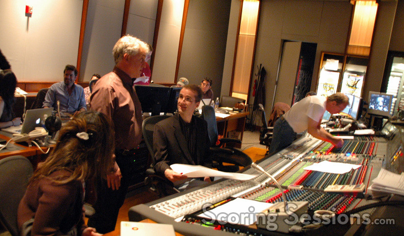 Orchestrator Dana Niu, contractor David Low, and orchestrator Andrew Kinney discuss a cue