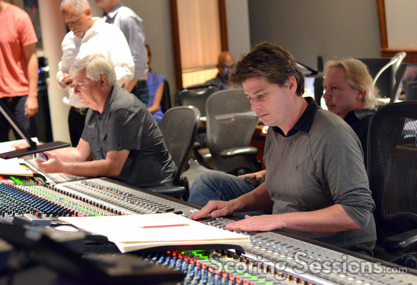 Orchestrator Dave Metzger and scoring mixer Dave Boucher review the score