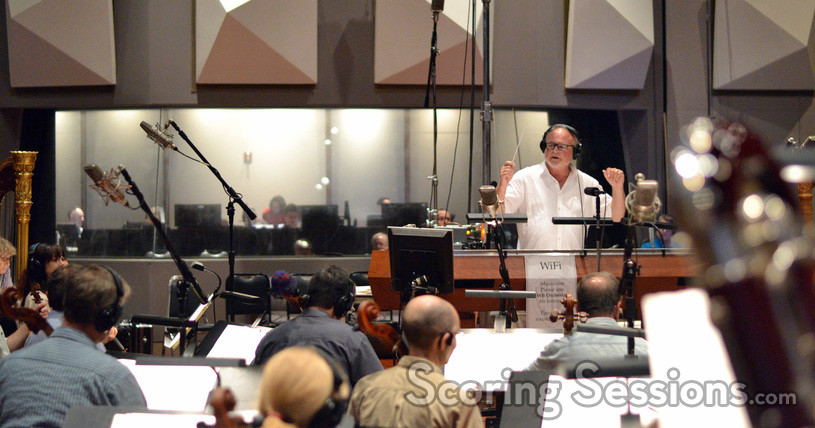 Conductor Don Harper records a cue from Moana with the orchestra