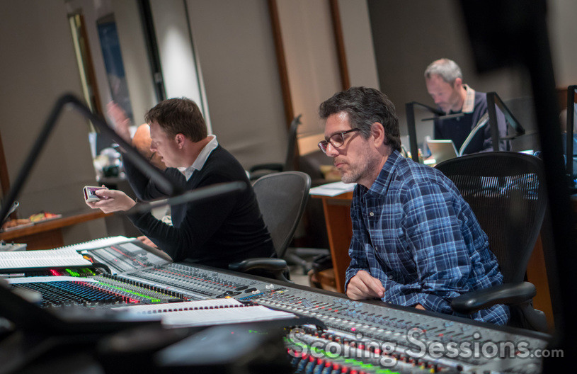 Orchestrator Stephen Coleman gives feedback from the booth while recording mixer Tom Hardisty looks over his score