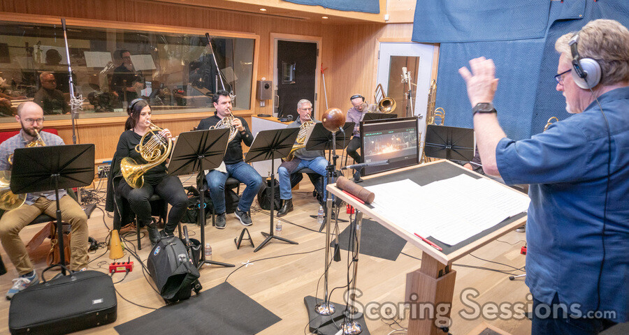 Orchestrator Pete Anthony conducts the winds and brass session