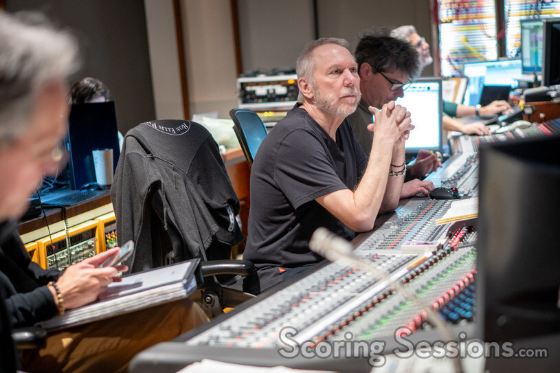 Composer Mark Mancina listens to a cue
