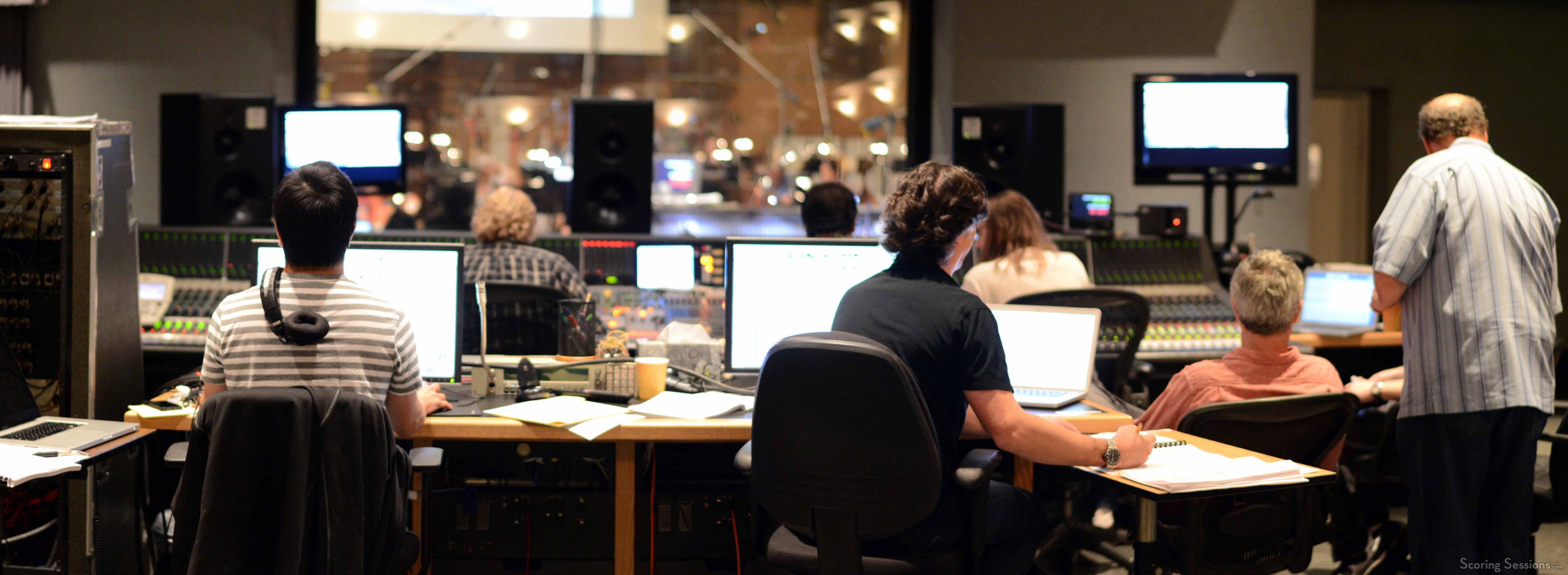 The booth watches as a cue from Grudge Match is recorded