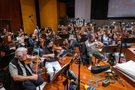 The violin section performing on Moana