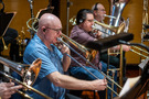 Alex Illes, Craig Gosnell, and Doug Tornquist perform on the low brass